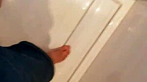 Someone using the bathroom for peeing