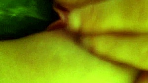 she indulges in self-pleasure using a cucumber in her intimate moments