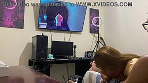 Hey, she's sucking him off while he games on his console! 😏