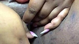 ebony beauty fingers herself to intense squirting orgasm