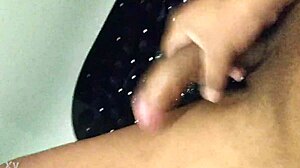 Amateur masturbates big black cock to cum in shower handjob