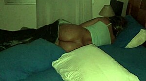 My wife relaxes in bed at home