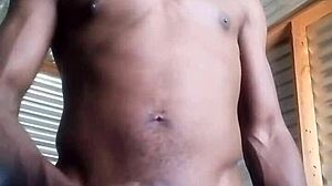 Horny amateur kneels to masturbate big black cock with huge balls