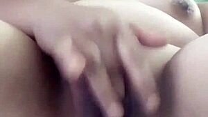 Pornstar Poosoo Boldly Fingers Herself.