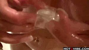 A hot brunette fingers herself with toys in the bathtub