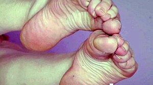 Sylvia shows nude legs and feet in relaxed pose