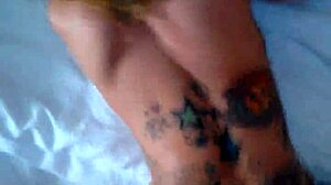 Tnasty 2 with heels and tattoos