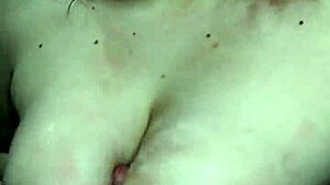 Deepthroat and breast play with a cock