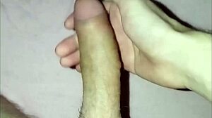 a young guy plays with his dick solo