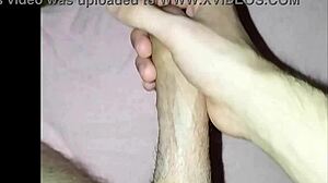 a young guy plays with his dick solo