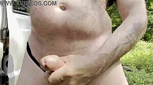 Gay man strokes big cock solo in woods