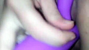 A young woman explores solo masturbation in private.