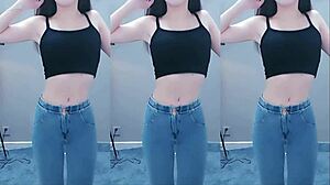 Pretty Chinese girl dancing with vibrator on cam