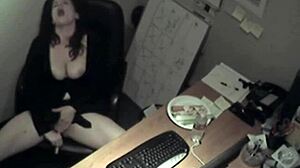 secretary in uniform rubs her boobs and masturbates to orgasm in the office