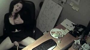 secretary in uniform rubs her boobs and masturbates to orgasm in the office