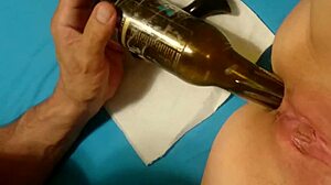 Wife inserts bottle in ass