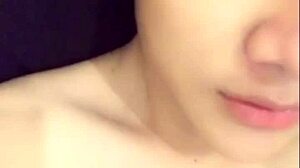 Gay Vietnamese guy shows off and gives handjob live