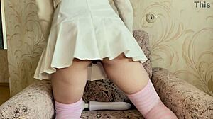 girl in white skirt masturbates with vibrator