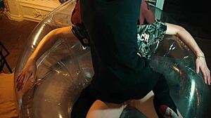Two handsome men enjoy an inflatable chair together