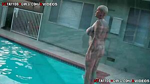 Blonde with big tits lounges by the pool