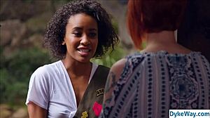 Black and white lesbians engage in passionate kissing and roleplay.