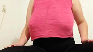 The teen cowgirl in a pink top rides outdoors, playing with her big boobs until orgasm