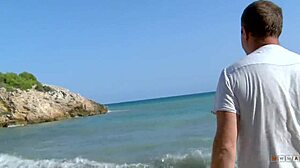 Busty cougar lets stranger play with her huge tits on the beach