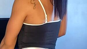 Tattooed brunette maid acts naughty in solo scene