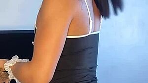 Tattooed brunette maid acts naughty in solo scene