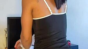 Tattooed brunette maid acts naughty in solo scene