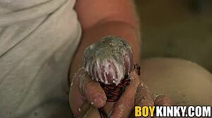 Gay BDSM scene with wax and handjob