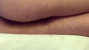 Teen’s super hairy pussy pulses in close-up orgasm while watching porn.