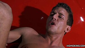 Hey, check these strong gay couple banging on a red car roof