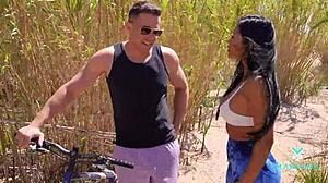 Mariana Martix rides cyclist Alberto Blanco outdoors