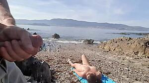 Nudist MILF blows and flashes on the beach
