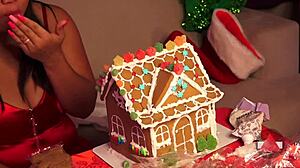 Girlfriend and friend make gingerbread house for christmas