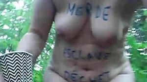 Female slave masturbates in the forest under bdsm control