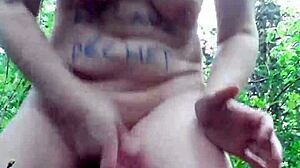 Female slave masturbates in the forest under bdsm control