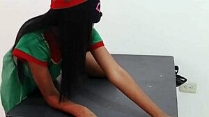 Celebrating christmas in costume, taking off clothes while dancing on the desk