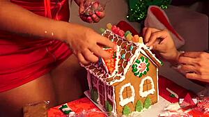 Girlfriend and friend make gingerbread house for christmas