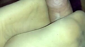 Beautiful girlfriend gives a sensual footjob in sheer nylons
