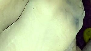 Beautiful girlfriend gives a sensual footjob in sheer nylons