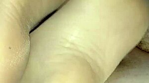Beautiful girlfriend gives a sensual footjob in sheer nylons