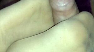 Beautiful girlfriend gives a sensual footjob in sheer nylons