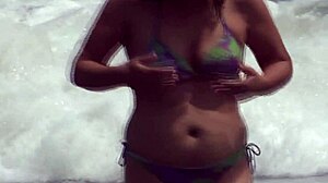 Stunning 59-year-old Latina mature shows off bikini body at beach