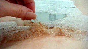 Annie's big tits fingered in monster bath bubbles