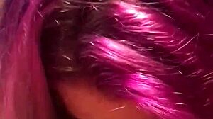 A blonde with purple hair gives a blowjob and gets a mouthful of semen
