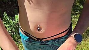 Wife sneaks quick handjob during walk with pierced nipples showing