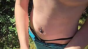 Wife sneaks quick handjob during walk with pierced nipples showing