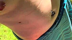 Wife sneaks quick handjob during walk with pierced nipples showing
